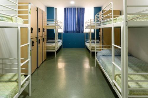 bed in 8-bed dormitory with private bathroom