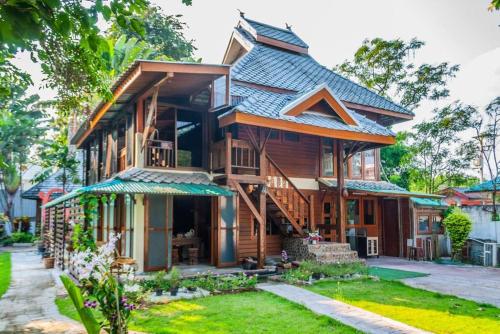 Thai Traditional wooden houses with flower gardens