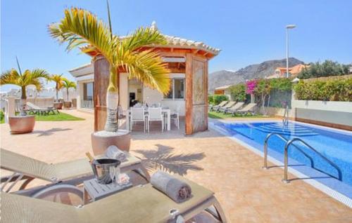 Beautiful home in Santiago del Teide with Outdoor swimming pool, WiFi and 4 Bedrooms gîte à louer Playa de la Arena