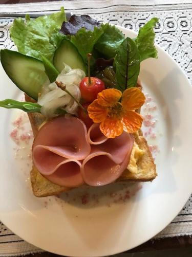 a white plate topped with a sandwich and vegetables, Yamagata Zao Pension Aplon Stage in Yamagata