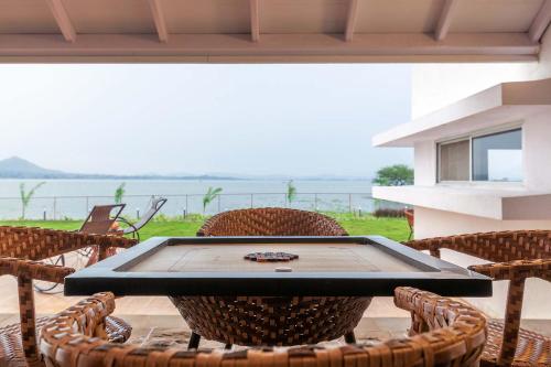 StayVista's Eva Villa - Lakeside Luxury with Modern Decor, Pool & Expansive Lawn - Near Sula