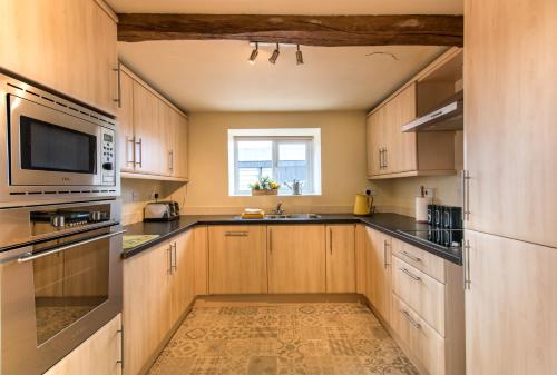 厨房, Valley View Farm Holiday Cottages in 老比兰德