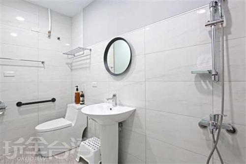a bathroom with a toilet, sink, and mirror, Ark stay in Nantou