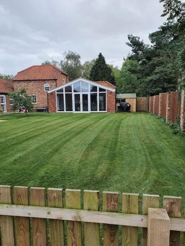 willow tree farm cottage with BBQ hut