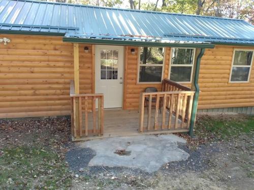 Cabin with a tree house on a buffalo farm . - Marshall