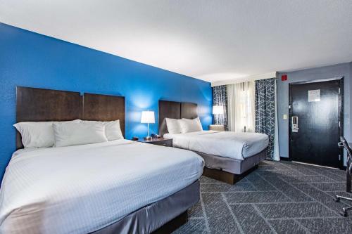 Queen Room with Two Queen Beds and Word Desk - Pool View