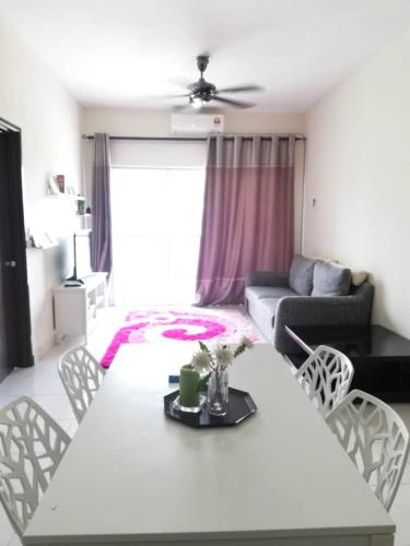 a living room with a table and chairs, Ijanina Homestay in Klang