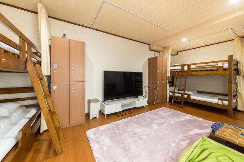 ห้องส่วนกลางสำหรับนั่งเล่น/ดูทีวี, Woman Only Guesthouse Nanohana (Female only) in เกียวโต