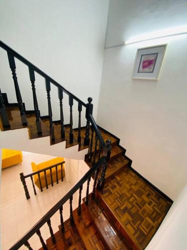 a staircase leading up to a room with a bunch of stairs, Johor Lovy Ros Homestay/12pax/Wifi/IKea Jusco in Johor Bahru