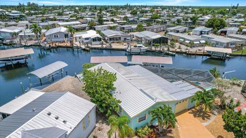 Waterfront Petite Retreat with Private Pool & Gulf Access - Villa Boat House - Roelens Vacations in Saint James City