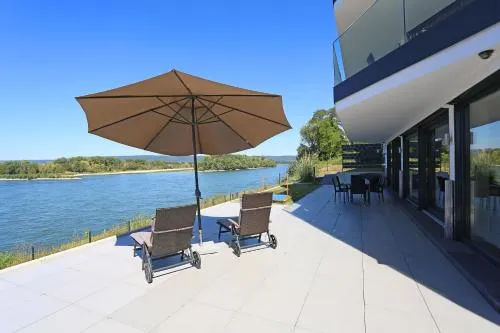 Exklusives Rhein-Lounge Apartment mit direktem Rheinblick, Sauna, 2 Schlafzimmern, Parkplatz für bis zu 5 Gäste in Urmitz, Deutschland