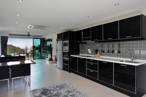 Kitchen, Absolute Twin Sands Resort and Spa near Whalecome Home Cooking