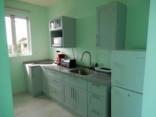 Kitchen, Oistins Bayview Apartments in Oistins