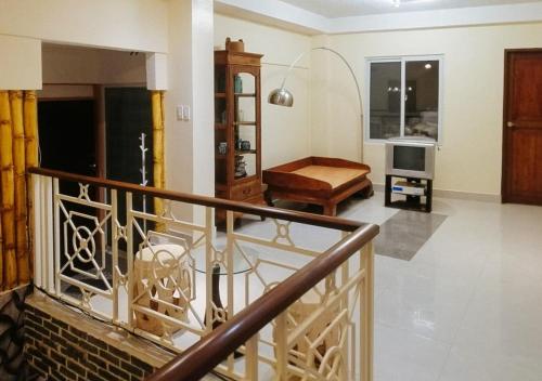 Shared lounge/TV area, RedDoorz @ Elicon Suites Tagbilaran near Baclayon Museum
