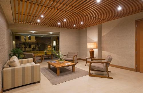 ห้องส่วนกลางสำหรับนั่งเล่น/ดูทีวี, Hotel Atacama Suites in โกเปียโป