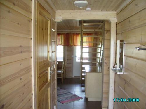 a room with a door leading to a hallway, Arctic Polar Holiday Village in Kilpisjarvi
