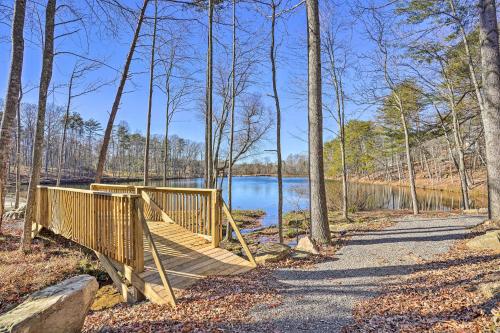 Serene Lakefront Cabin with Deck and Fire Pit!