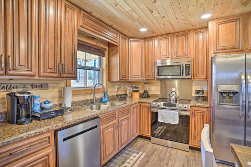 Serene Lakefront Cabin with Deck and Fire Pit!