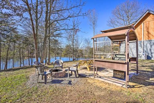 Serene Lakefront Cabin with Deck and Fire Pit!