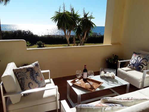 Holidays & Home Beachfront Neptuno I, Sea Views,Pool,Garden, Elviria - Tap to explore photos