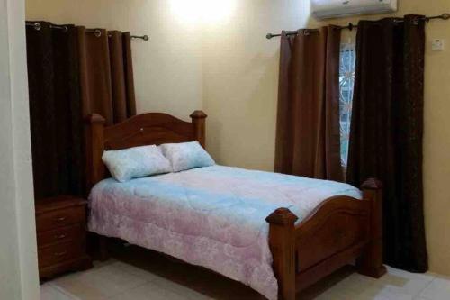 Guestroom, Lowell Home away Home situated in White water St Catherin in Spanish Town