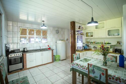 Kitchen, Caiowa Floripa guesthouse in Morro das Pedras