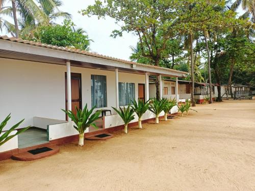 French garden Pragash Beach Hotel – Trincomalee, GA