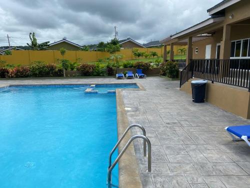 Swimming pool, L&V Paradise Vacation Home with Pool and Gym in Falmouth