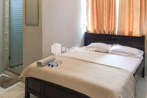 Aquino Marito Homestay Mitra RedDoorz
