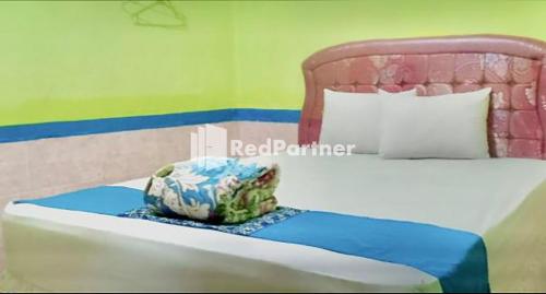 . Hotel Indah Grogot Syariah Mitra RedDoorz