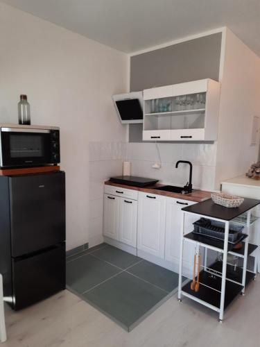 廚房, Ferienwohnung MeerGlück in der Ostseeresidenz Gandarm (Ferienwohnung MeerGluck in der Ostseeresidenz Gandarm) in 賓多夫