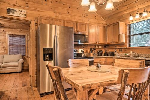 Riverfront Cabin with Hot Tub and Mountain Views!