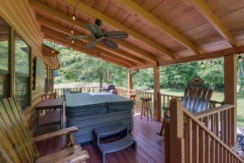 Riverfront Cabin with Hot Tub and Mountain Views!