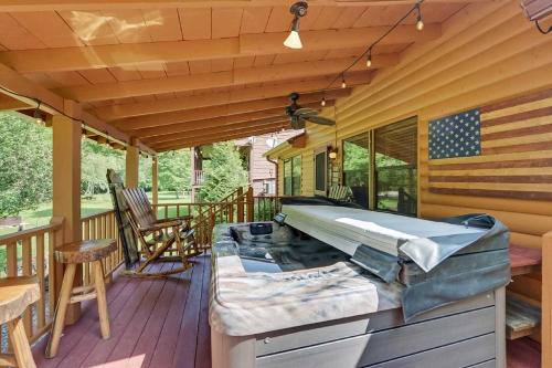 Riverfront Cabin with Hot Tub and Mountain Views!