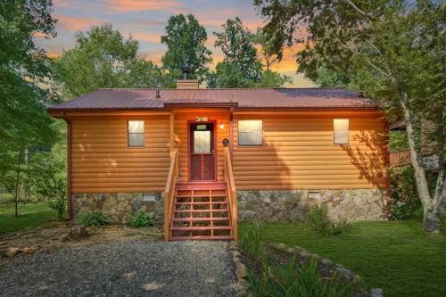 Riverfront Cabin with Hot Tub and Mountain Views!