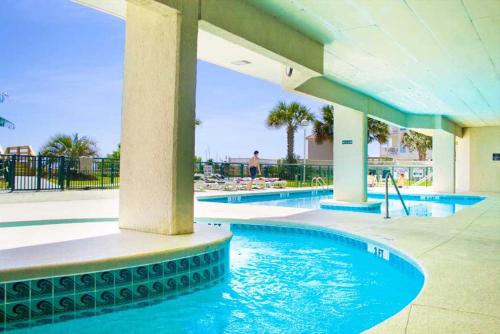 Windy Hill Dunes 704 - 7th floor windy hill condo with a fitness room and pools plus Wifi