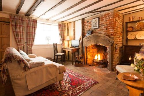. Spadgers, a flax workers cottage next to fields in a Medieval Village