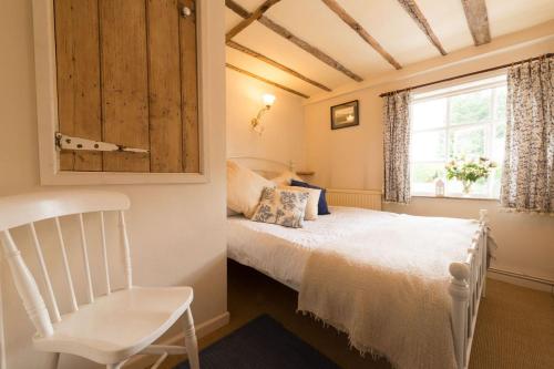 Spadgers, a flax workers cottage next to fields in a Medieval Village