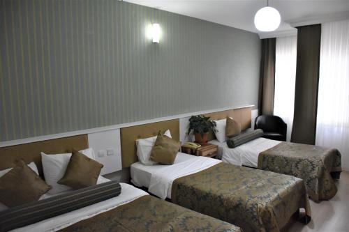 Chambre triple, 3 lits