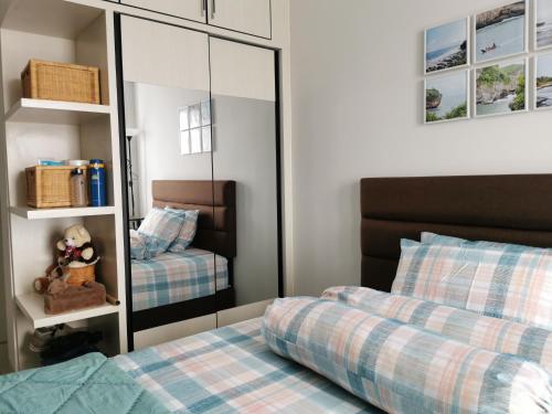 A Peaceful Room at Barsacity Apartment by Ciputra