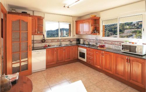 Amazing home in Alella with 5 Bedrooms, WiFi and Swimming pool