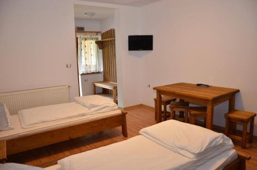 Double Room with Private Bathroom and Two Extra Beds