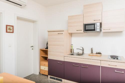 Three-Bedroom Apartment room in Apartments Marcel