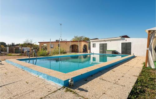  Amazing home in Sanlucar La Mayor with WiFi, 3 Bedrooms and Outdoor swimming pool in Sanlúcar la Mayor