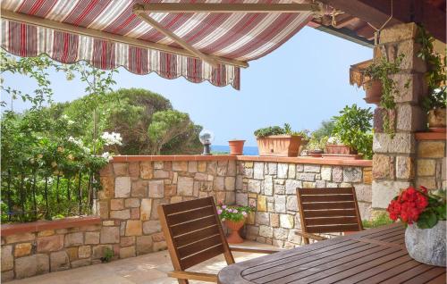 Nice home in Porto Scudo with Outdoor swimming pool and 1 Bedrooms gîte à louer Porto Vesme