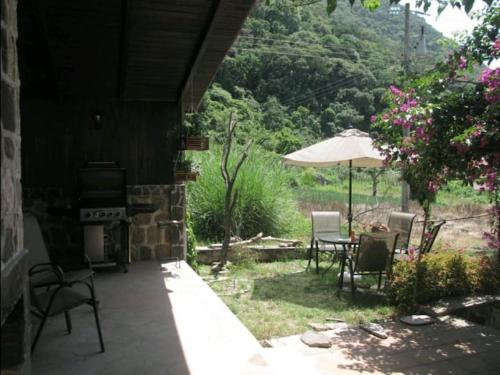 Casa BuenAventura - Cozy country cottage with wooden ceilings and stone walls within nature reserve