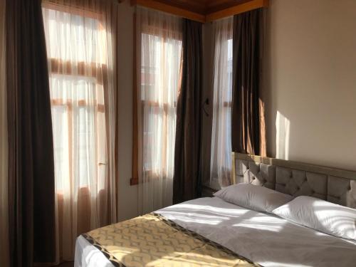 Green Suites Room Type - Quadruple Room with Balcony
