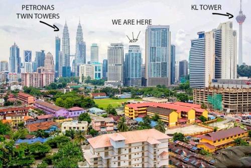 a cityscape of a city with tall buildings, Valencia Dorm summer suites KLCC in Kuala Lumpur