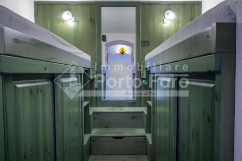 23 BAIA FARO - Trilocale mansardato con ampia terrazza vista mare