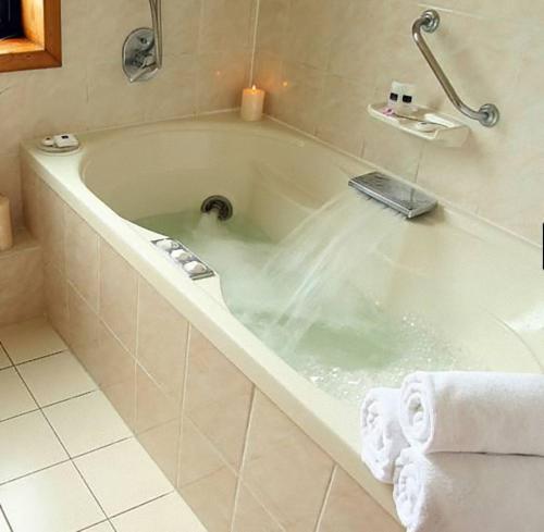 Fürdőszoba, abba Presidente Suites Puerto Montt in Puerto Montt